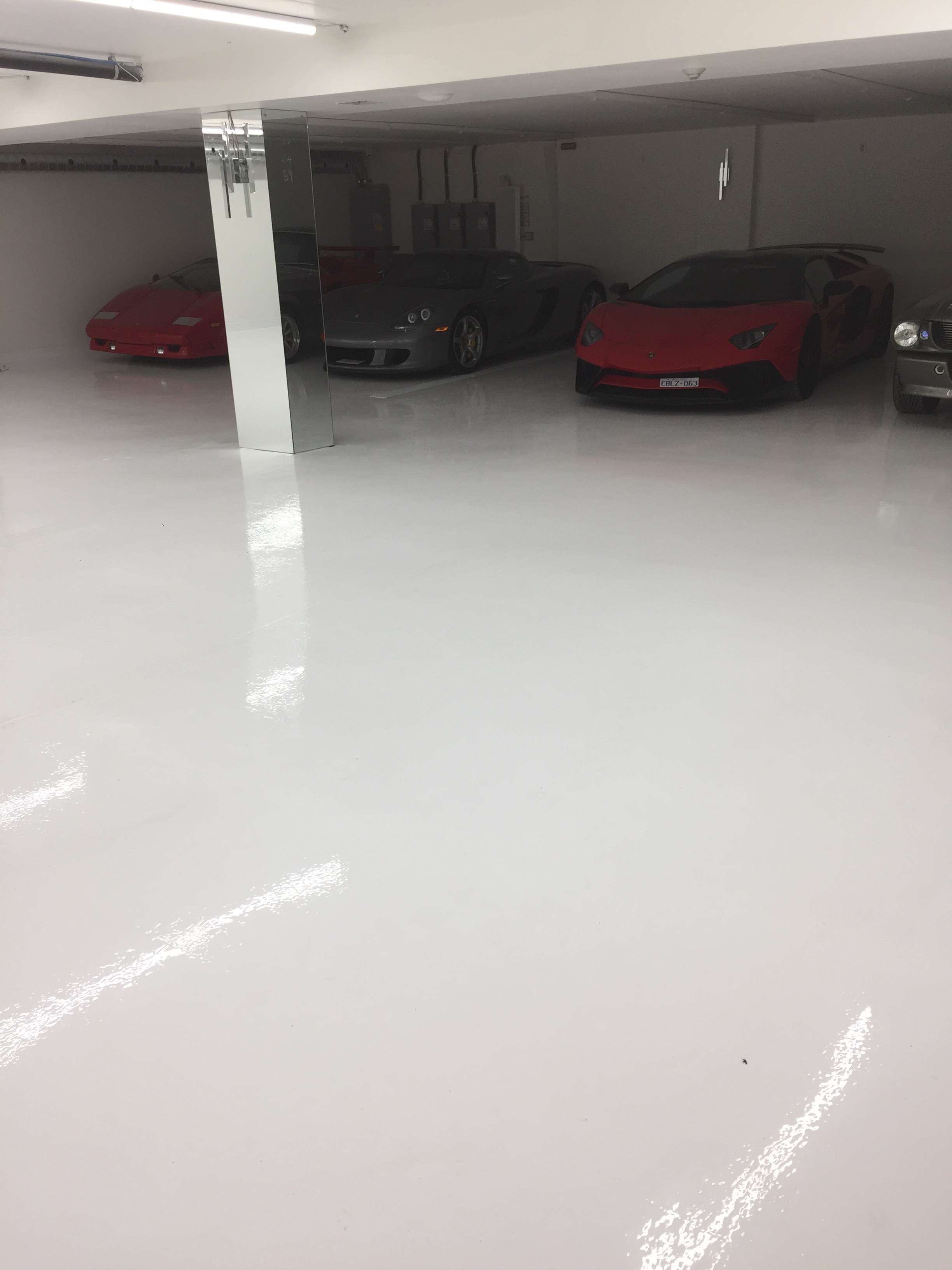 White Epoxy Floor for Exotic Car Garage in Thornhill